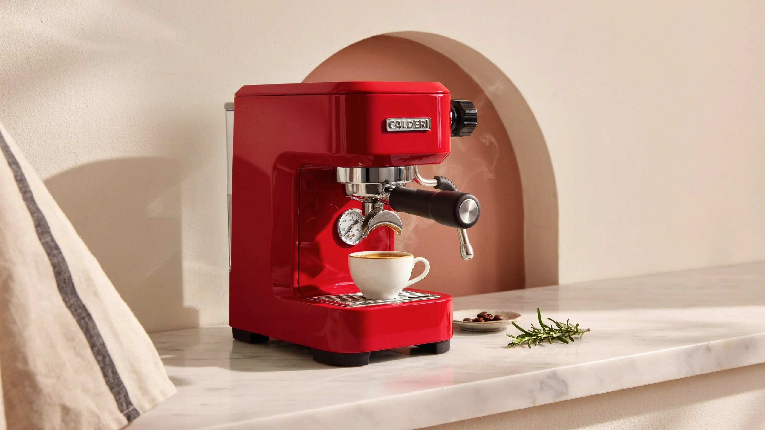 The same espresso machine with red enamel after the first edit